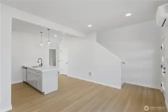 Open-concept main level connecting kitchen, dining, and living areas