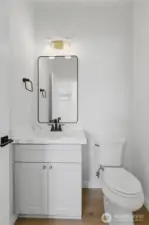 Main-level powder bath with Moen fixtures