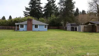 2 outbuildings plus a covered patio for added storage needs and entertaining.