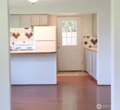 View to the kitchen from the living room creates a semi-open concept