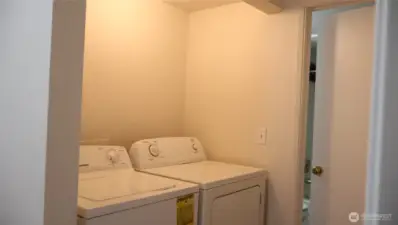 Laundry area is located in the hallway for ease of access.