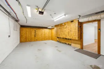The extra long garage has built-in cabinets along two walls.