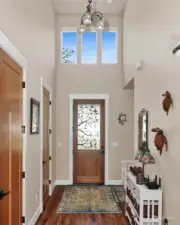 huge vaulted entry with walk in pantry around the corner from kitchen.