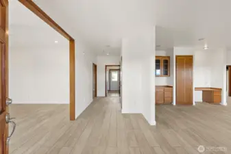 Entry way with living to the left and dining/kitchen to the right