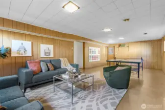 Huge rec room with great ceiling height and exterior door.