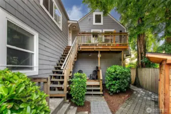 Tucked behind a laurel hedge and shaded by mature maples, Laurel Gate’s rear courtyard offers both privacy and community. The upper and lower decks create semi-private outdoor zones for units 4–8, while the hand-built entry stairs reflect decades of careful stewardship by a master carpenter-owner. A rare blend of character and function in a Capitol Hill apartment investment—with zoning (LR3[M]) that allows for long-term development upside.