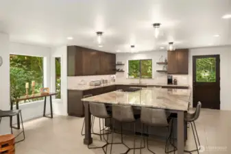 New kitchen remodel with quartzite counters, custom cabinets with under cabinet lighting, and a dream island with ample seating.