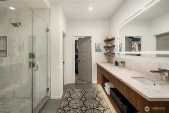 Another view of the primary bath with a walk-in closet.