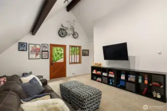 Another view of the upper level bonus room with access stairs to the back patio.