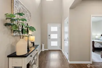 Light & bright entry w/frosted glass front door for privacy.