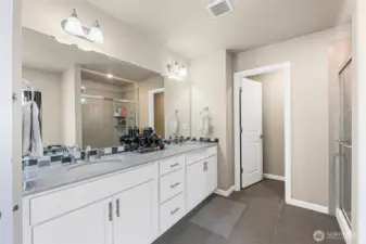 5-piece bath w/tile floors, quartz counter tops, double shower, garden tub & private toilet.