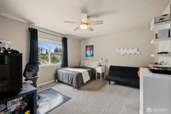 Large bedroom 3 w/walk in closet & ceiling fan.