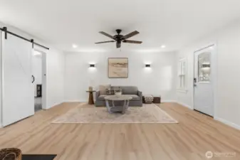 Through the barn door is the primary suite off the living space
