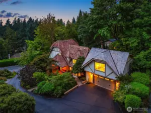 Storybook Tudor curb appeal—nestled in lush gardens with timeless architecture and a brand-new attached/integrated ADU above the garage