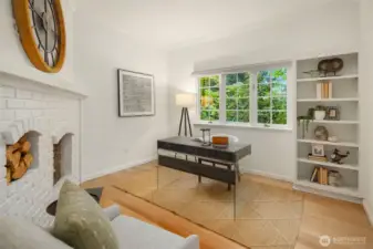 Cozy study with fireplace and garden outlook—perfect for work or reading