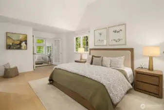 Vaulted primary suite with serene garden views and abundant light