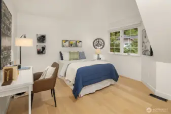Comfortable secondary bedroom with charming alcove and desk space