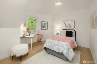 Bright third bedroom with garden outlook and flexible use options