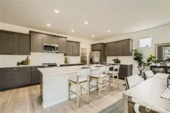 Dining to Kitchen  Photos are representation as the home is under construction.