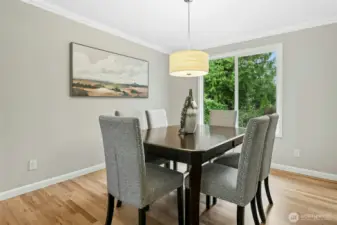 Formal dining room with a beautiful outlook.