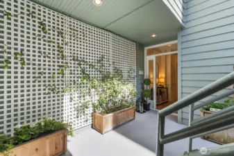 Private front patio, 5 steps at the top about 7 at the bottom. Handrails on both sides.