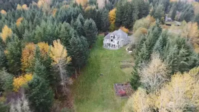 5 Acres overview of the back of the home. Wild life abounds, deer and elk see pictures in the home book.