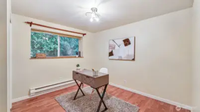 This versatile bedroom with beautiful LVP floors and natural light is ready to adapt — office, nursery, gym, or guest room!