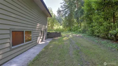 Side yard space ready for your garden, storage, or creative ideas!