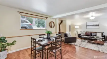 Step into the home on beautiful LVP floors with direct access to the dining area, living room, and kitchen.