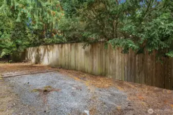 RV parking area off the garage side of house. Man door from garage lead's out to this area.