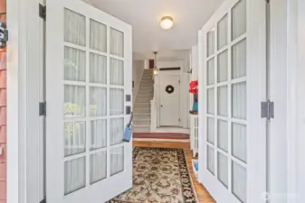From the inviting front porch, French doors draw you into this breathtaking home.