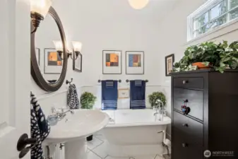 This remodeled bath blends timeless charm with modern elegance. Soak tub with convenient sprayer invites you to relax and unwind after a long day.