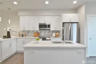 Bright kitchen with large quartz island