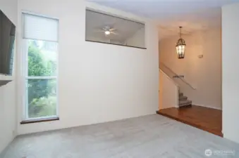 Formal living area with views of the entry and the loft above.