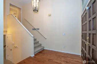 Impressive main entry with elegant staircases leading to both the upper and lower levels.