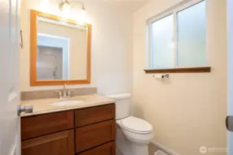 Lower-level powder room conveniently situated just off the family room.