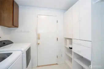 Additional cabinet storage in the utility room—essential for every functional space.