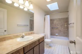 Upper-level full guest bathroom.