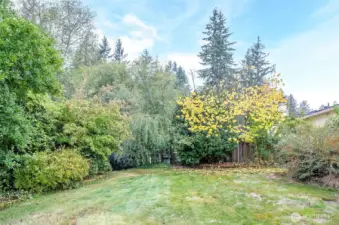 Mature landscaping with the property backing onto a peaceful greenbelt.