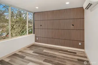 Primary suite on third floor holds a king size bed.