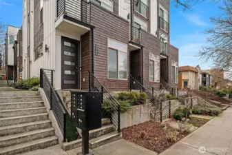 View of street facing units with stairs to access 5616C sitting back from the street.