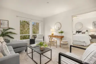 Comfortable main living room offering a functional layout with soft natural light and a peaceful outlook.