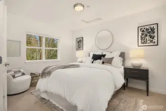 Light-filled bedroom retreat with generous windows, peaceful outlook, and a calm, neutral palette.
