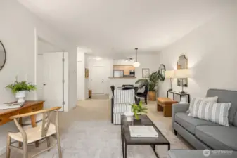 Thoughtfully arranged living area with defined spaces for lounging and dining, opening directly to the private bedroom.