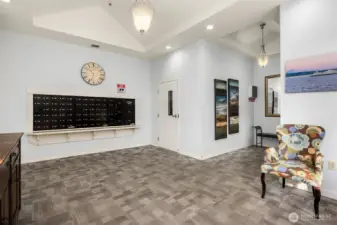 Secure residential lobby with mail center and elevator access, offering convenient entry for residents and guests.