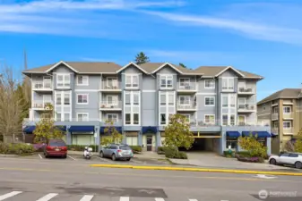Welcoming exterior with classic Pacific Northwest architecture, covered awnings, and a central location that blends convenience with a peaceful island setting.