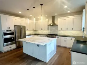 upgraded KitchenAid appliances,  including a Wall oven & microwave.  6 burner gas cooktop and French door Refrigerator.