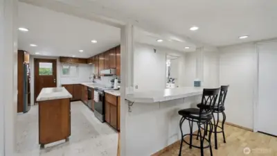 Convenient serving bar connects the kitchen to the dining area—perfect for casual meals or entertaining.