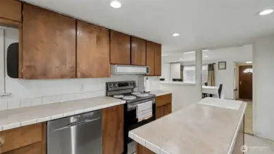 Spacious kitchen with large island, abundant counter space, and plenty of cabinets for all your storage needs.