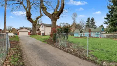 Home sits back from the road, offering ultimate privacy on this serene riverfront property, situated on a fully fenced yard.